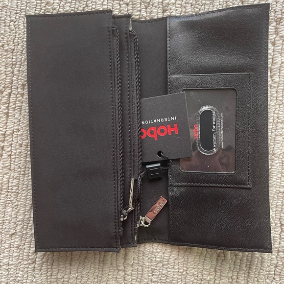 HOBO black leather wallet. NWT zippered pockets, cc slots. It’s kind of perfect. - Picture 2 of 7